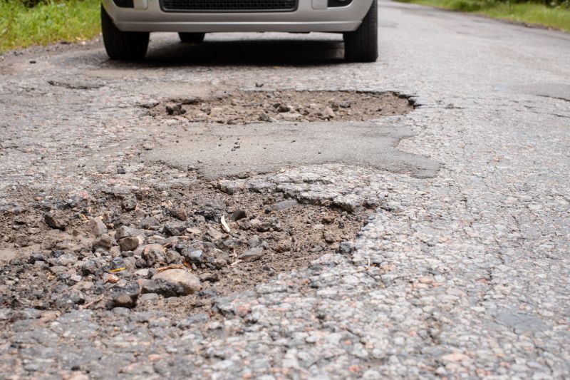 How Weather Conditions Affect Asphalt Cracks And Potholes